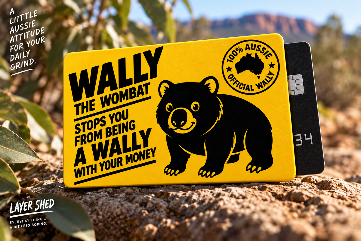 Wally the Wombat yellow card sleeve resting naturally on rugged Australian rock surrounded by eucalyptus leaves and native bushland. The warm outdoor setting and softly blurred Australian landscape showcase the sleeve as a practical everyday card accessory with a distinctly Australian character.